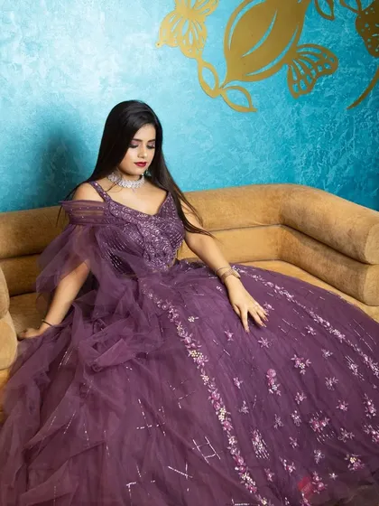 A seated portrait for the Odhni brand, showing how the gown looks when sitting. This provides a different perspective and adds a touch of regal elegance to the series.