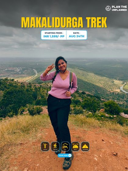 A trekker flashes a peace sign at the top of Makalidurga, a popular one-day trek from Bangalore.