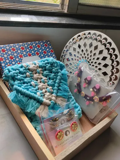 Here is another variation of a custom gift hamper. This one features a beautiful blue macrame purse, a unique necklace set, and some of my signature handmade earrings, all ready to be gifted.