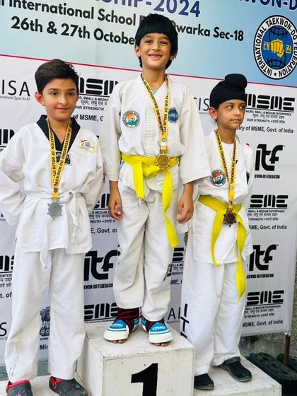 Young champions on the podium at the Delhi State Championship, showing the bright future of our academy.