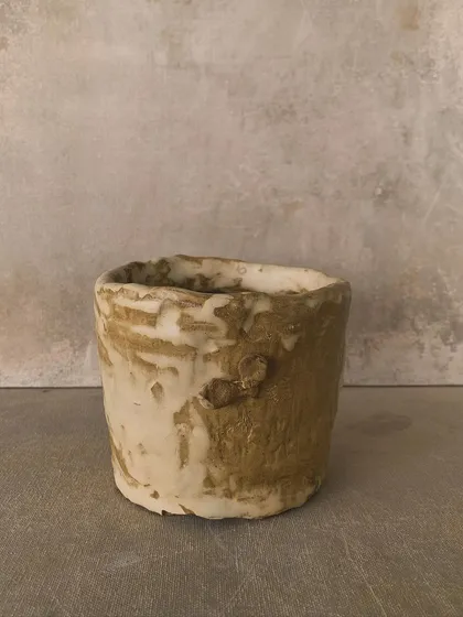 A collection of pieces with different textures and glazes, showing the beauty of imperfection.