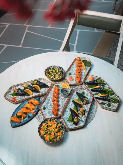 A weekend indulgence, our Sushi Vita spread is a testament to precision and freshness. This platter features a variety of classic nigiri, inventive rolls, and our signature chirashi, available exclusively for our weekend guests.