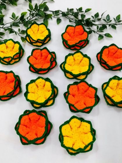 My yellow and orange lotus coasters arranged together, showing how you can mix and match colors for a vibrant festive look.