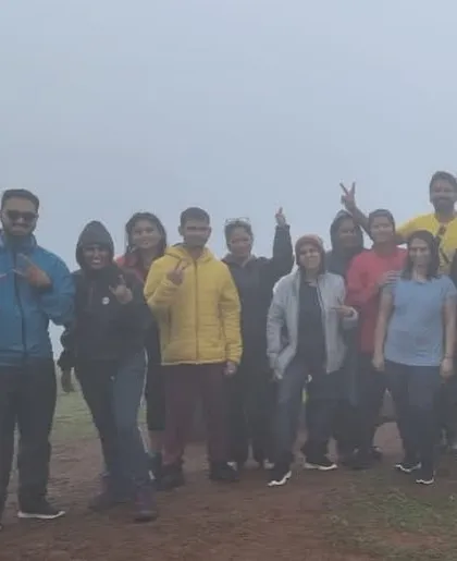 The group posing in the fog during our Sakleshpura trip. Even when the weather is challenging, the adventure is always worth it.