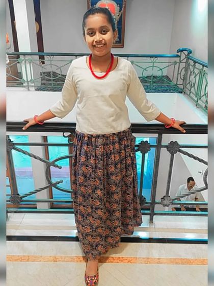 I love seeing how you style my pieces. Here, our Kalamkari skirt is paired with a simple cream top, creating a chic and comfortable outfit. We also offer customizations for kids over 10 years old.