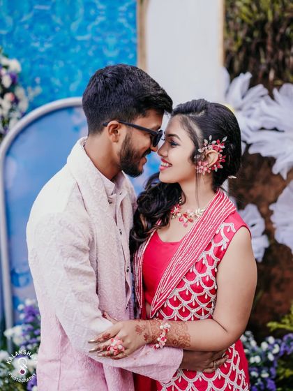 An intimate and happy moment between the couple at their outdoor Haldi celebration.