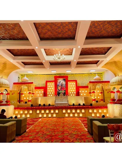 The final look of our Rajasthani theme stage decor. The multi-level setup, warm lighting, and traditional motifs create a majestic setting perfect for a royal wedding celebration.
