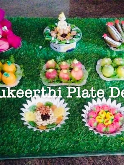 A lovely platter arrangement for an engagement at RVS Mahal. The display includes beautifully decorated fruits, sweets, and a set of couple dolls.