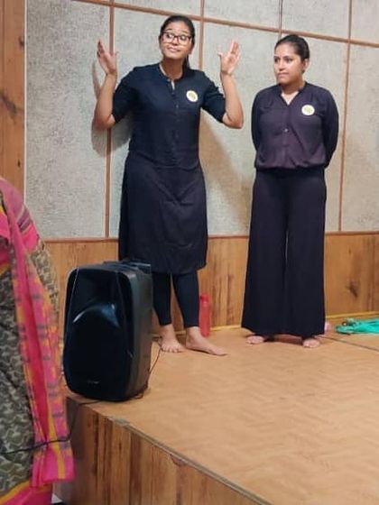 A young audience member gets a chance to speak on the microphone after our show, sharing her thoughts with everyone.