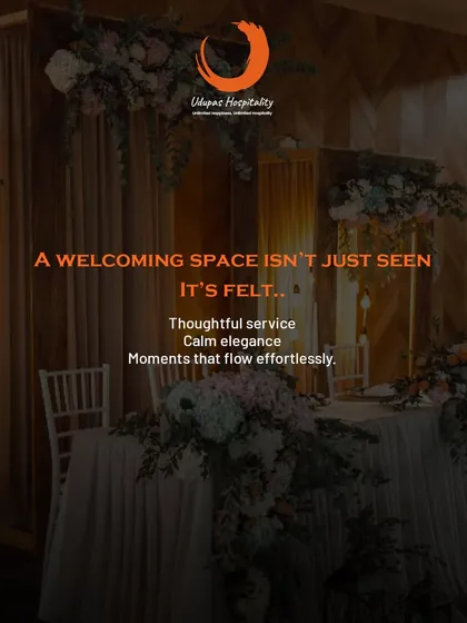 A beautifully set dining table with elegant floral arrangements. We believe a welcoming space isn't just seen, it's felt through thoughtful service and an atmosphere of calm elegance.