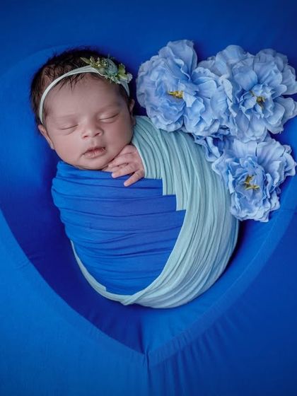 Dreaming in shades of blue. This artistic shot uses a heart-shaped prop and a monochromatic color scheme for a beautiful effect.