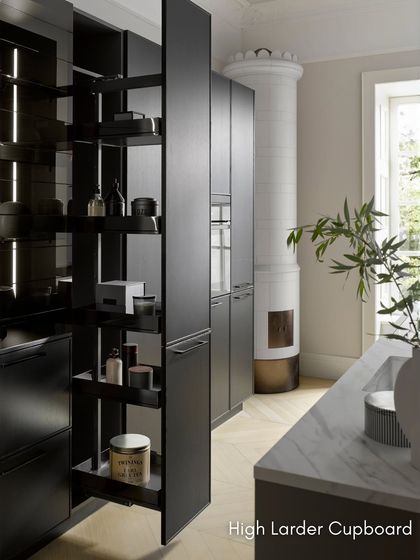 A high larder cupboard with a tandem swivel pull-out. As you open the door, the rear shelves automatically move forward, giving you a clear view and easy access to all your pantry items.