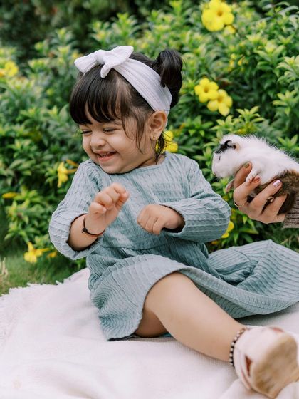 The pure joy of a little girl meeting a guinea pig at a farm. These sessions are perfect for animal-loving kids.