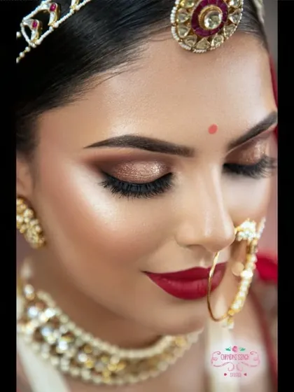 This look is all about the eyes and lips. A classic combination of bronze-gold eyeshadow and a bold red lip creates a bridal look that is powerful, confident, and absolutely timeless.