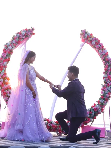The moment she says yes! The ring exchange during a beautiful beachside engagement ceremony.