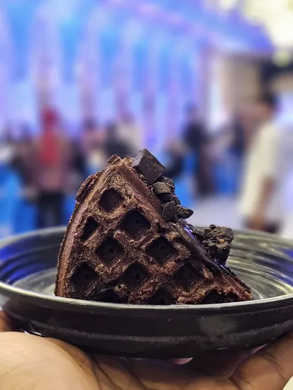 A rich and indulgent chocolate waffle slice, topped with chocolate chunks. A must-try for all chocolate lovers.