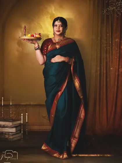 Another portrait inspired by the paintings of Raja Ravi Varma, with the mama-to-be holding a thali of offerings.