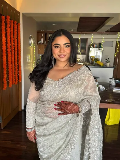 Another angle of this beautiful bride. Her soft glam makeup and elegant hairstyle are perfect for a sophisticated wedding event.