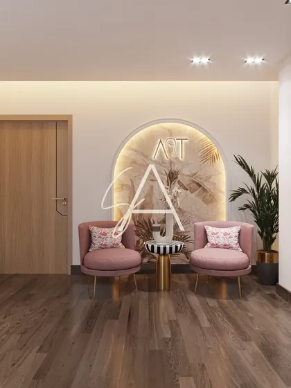 This is the patient waiting nook within the doctor's cabin, designed for comfort and privacy. The soft pink chairs and arched feature wall with botanical wallpaper create a calm corner for patients or family members to sit.