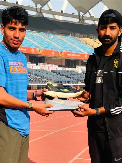 Another athlete receiving a pair of high-performance running shoes. This support can be the difference-maker in their career.