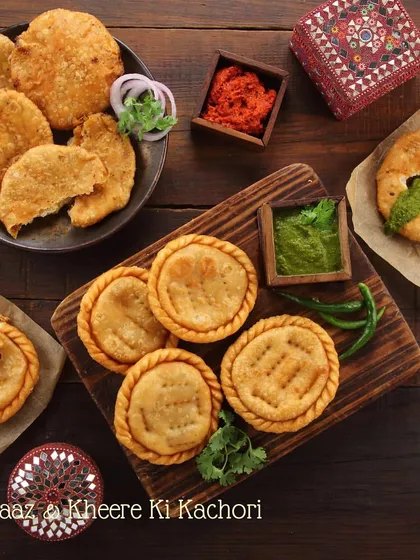 A platter of our most-loved kachoris. On one side, the classic spicy Pyaaz Ki Kachori, and on the other, our unique Sheherwali special, Kheere Ki Kachori, served with homemade chutneys.