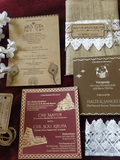 For a warm and rustic feel, we designed this invitation suite using natural jute fabric and lace. The set includes separate inserts for different functions like the Haldi and Sangeet, all held together with a personalized wooden tag.