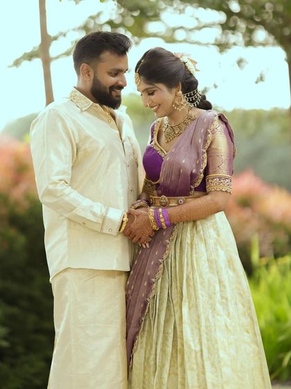 A sweet moment between an engaged couple. The soft colors and traditional silhouettes of their outfits were chosen to create a look of timeless romance.