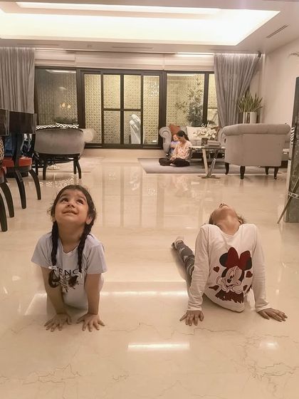 Strength meets flexibility. Two of our young students, Noor and Avika, holding their cobra pose during a warm-up session at our NFC batch.