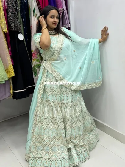 The client showing off the full flare and flow of the light blue lehenga. It’s a great option for a sangeet or reception.