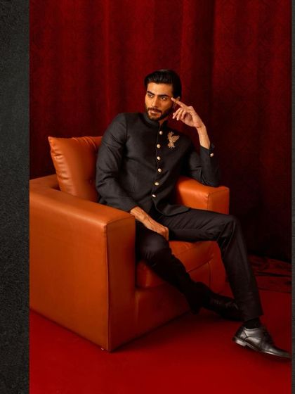 This dark, textured bandhgala with a single embroidered bird motif is for the man who appreciates subtle details. It’s a powerful, minimalist statement.
