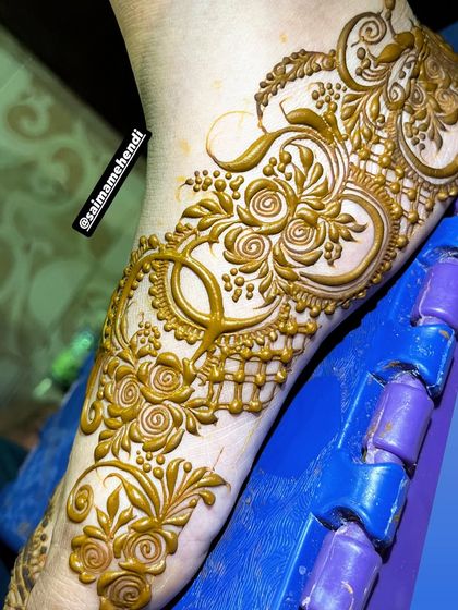 A unique and ornate foot design with intricate swirls and jewelry like details. This is a statement piece for your feet.