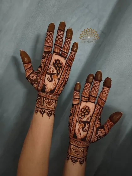 A classic Indian design featuring majestic peacocks. The intricate feather details and checkerboard patterns create a full and traditional look.