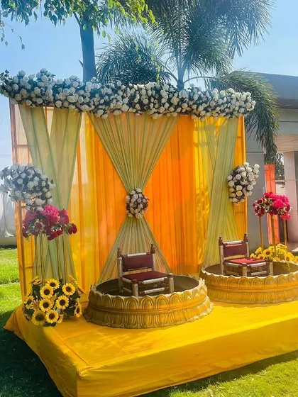 A closer look at the outdoor Haldi stage, showing the detailed floral work on the top and sides. I use a mix of real and artificial flowers to fit your budget and vision.