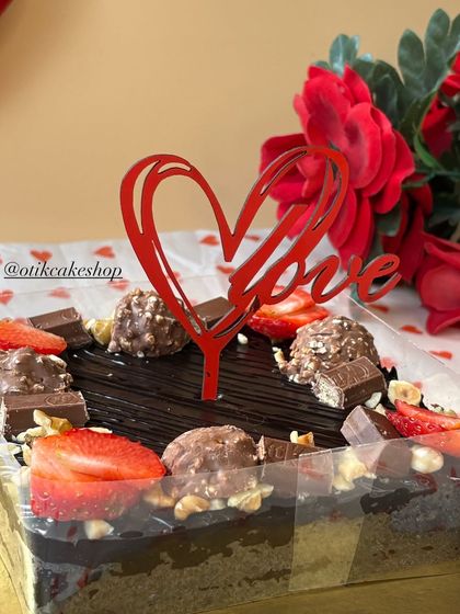 Our special Valentine's truffle cake is a chocolate lover's dream. We load it with fresh strawberries, Ferrero Rochers, KitKats, and nuts for an indulgent treat.