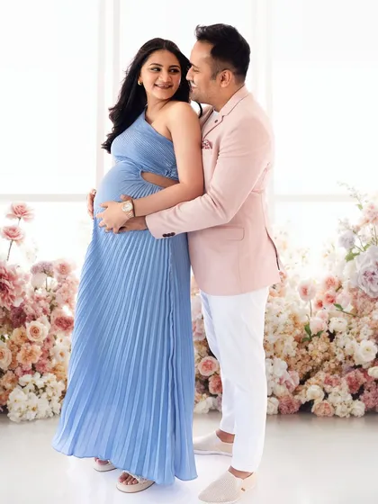 For maternity shoots, you deserve to feel like a queen. Here, we used a stunning floral backdrop in the studio to create a magical, romantic portrait for this beautiful couple.