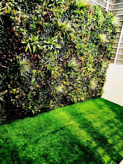 Another angle of the covered garden space, showing how the dense foliage of the vertical garden provides a rich, green view from every angle.
