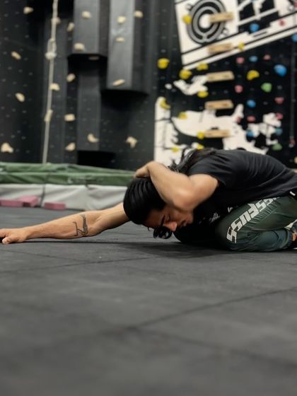 The child's pose with rotation is a key part of our thoracic opener routine. It helps improve spinal mobility and release tension in the upper back.