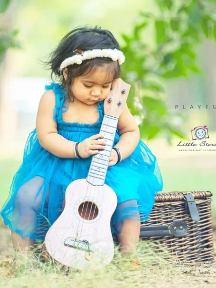 A quiet moment with her music. This photo captures the gentle and affectionate way children interact with new objects.