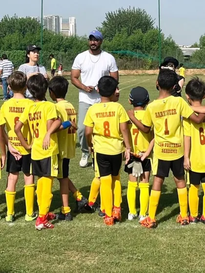 A coach with his arm around his team. It's more than just playing to win; it's about the journey of growth and the exhilaration of the game.