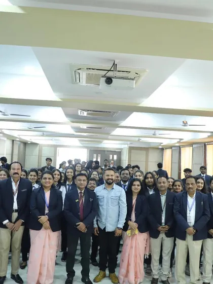 A group photo with the management and staff of D.Y. Patil College after the event.