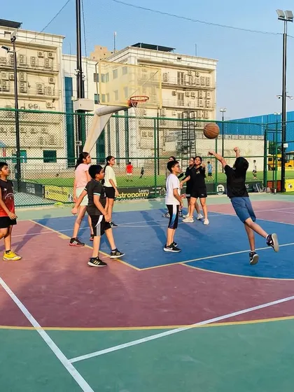 A young player takes a jump shot during a junior practice.