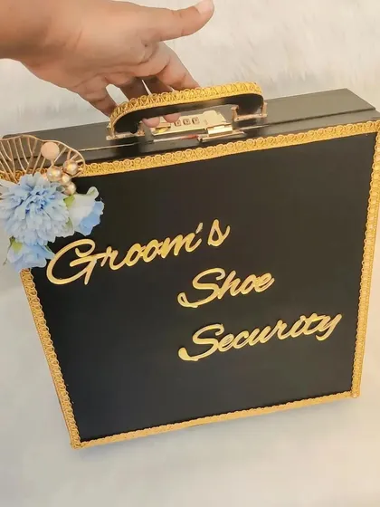 For a bit of fun during the 'Joota Chupai' rasam! I created this 'Groom's Shoe Security' box to add a playful touch to the tradition. It's a fun prop for the groom's side and always gets a lot of laughs.