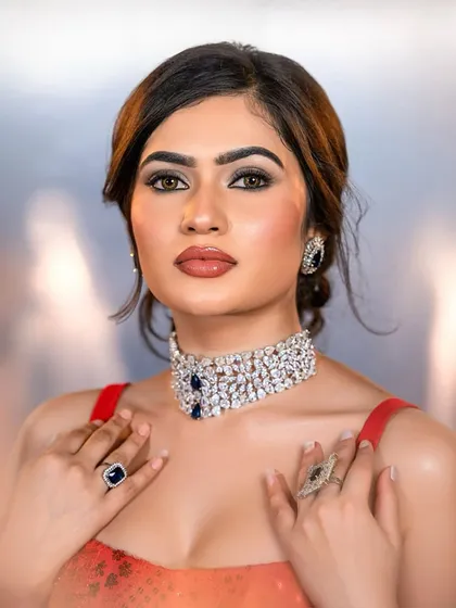 A powerful and glamorous reception look. This image highlights a bold smokey eye and perfectly sculpted features, set against a stunning diamond choker, a style perfect for evening events.