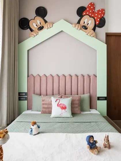 Designing for our youngest clients is always a joy. For this bedroom, we brought a touch of magic with a playful Mickey and Minnie Mouse mural peeking over a custom house-frame headboard, creating a fun and imaginative space for sleep and play.