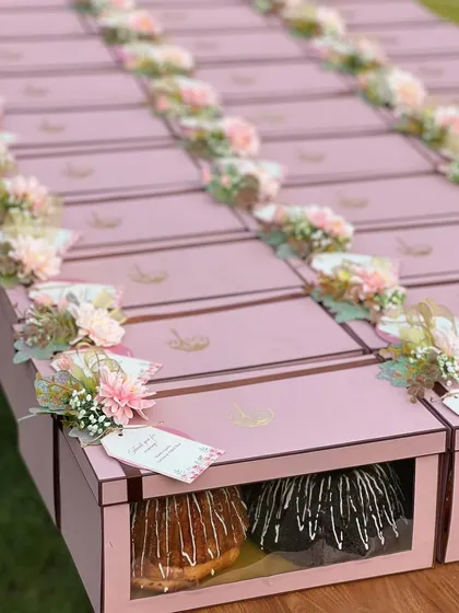 We believe in doubling the delight, which is why our twin bundt cake sets are a favourite for event return favours. This large order, prepared for a special celebration, features our signature cakes packaged in elegant pink boxes, each adorned with custom floral arrangements and personalised tags.