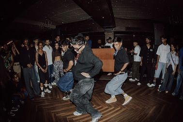 My crew and I in sync during a performance at Auro Kitchen & Bar. We specialize in creating these high-energy moments that become the highlight of the night.