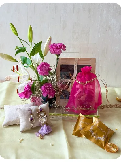 This Raksha Bandhan, gift a memory. This beautiful hamper includes fresh flowers, a Rakhi set, and our gourmet treats in an acrylic box.