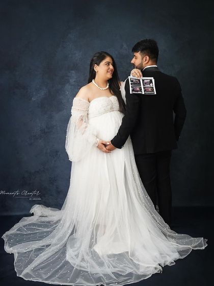 A playful and modern announcement. The couple holds the sonogram pictures on the dad's back, creating a fun and memorable reveal.