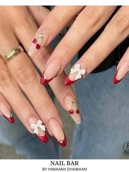 Another look at our cherry and bow design, combining red French tips with custom 3D elements for a unique and stylish manicure.