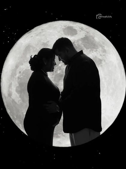 A romantic silhouette of a couple against a full moon backdrop, with added stars for a celestial feel.